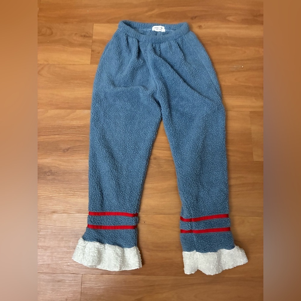 Blue Sherpa Cozy Pants with Red Trim and Cream Ruffle Hem